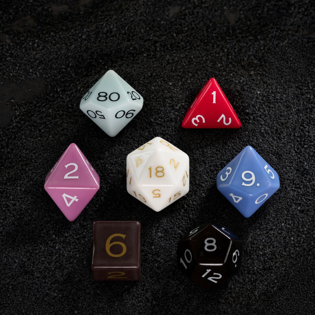 A complete collection of colorful glossy and matte ceramic polyhedral dice