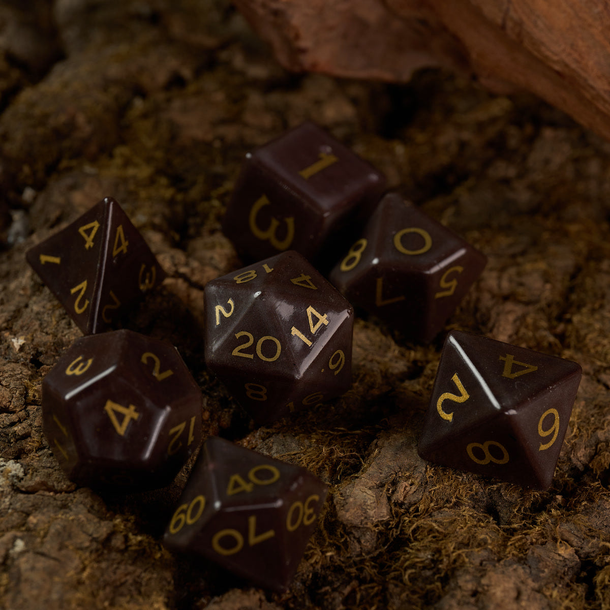 Brown ceramic dice on a textured tabletop